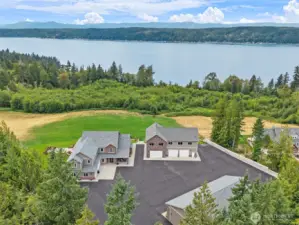 5 Acre estate w/ 3 distinct structures - main home, guest home & garage + additional shop.
