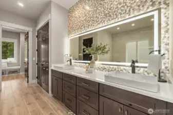 Main floor primary suite  5 piece bath w/ Pental Stella Claudis Quartz Countertops, Soaking Tub, Dual-Shower Heads, Double Vanity, Towel Warmer & "Closet by Design" Walk-in Closet. All Bathrooms w/ Amorho LED Lighting Mirrors.