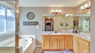 End your day in this luxurious primary 5-piece en suite featuring dual vanities, a soaking tub, and a separate walk-in shower for ultimate comfort and convenience.