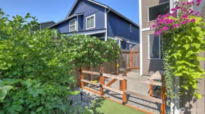 This gated rock pit play area can double as a dog run or garden staging area!