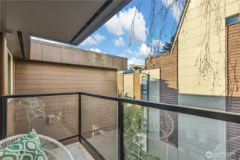 Covered balcony overlooking courtyard
