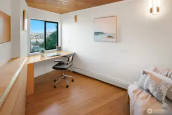 Bonus space with great views for hobbies or home office. Two built in custom desks