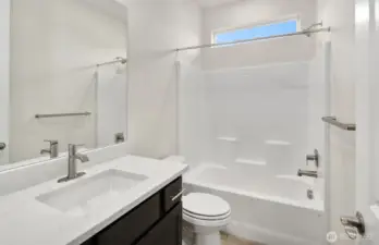 Bathroom finishes vary per home. Photo of same design, not this specific house.