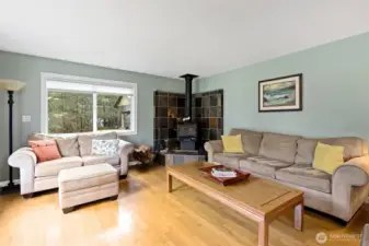 Wood burning fireplace with slate tile surround.