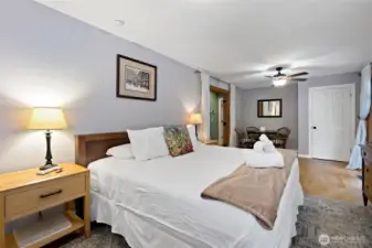 Primary bedroom with French doors to deck.
