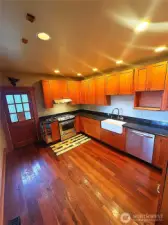 Kitchen leads to bark deck