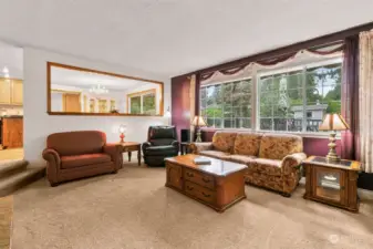 This living area is right off of the kitchen and eating area making it great for entertaining.