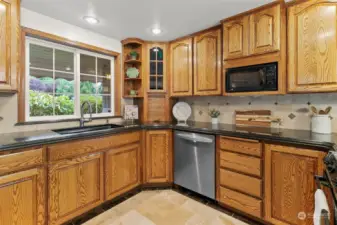 Solid wood cabinets through out the kitchen offer great storage.