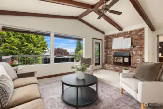 Vaulted ceilings in the living room make for a light-filled, yet cozy, place to sit with a toasty fire in the fireplace.