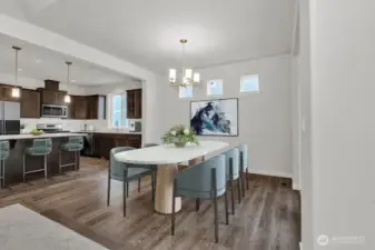 Dining room provides space for conventional dining. Photo is virtually staged from same plan on different lot, for reference only.