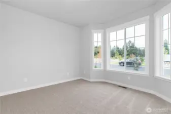 Charming details throughout include a bay window in the front bedroom.