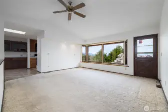 Living room with dining room to left