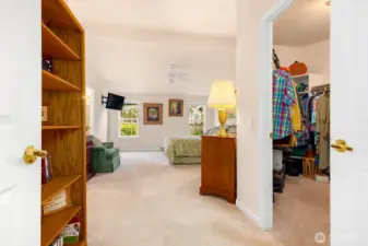As you enter the massive primary bedroom suite...