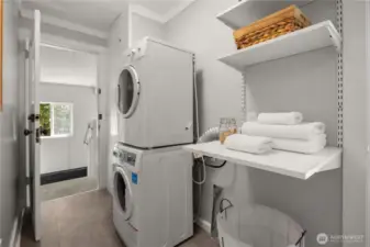 Laundry area with extra storage.