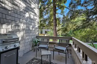 This deck sits right off the great room and looks out over the manicured grounds with brick walking paths and mature landscaping.