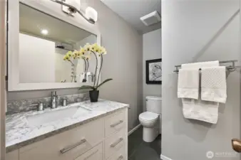 Full hallway bath also offers radiant heat in the floors and gorgeous granite countertops.