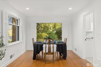 formal dining room area that looks out onto backyard
