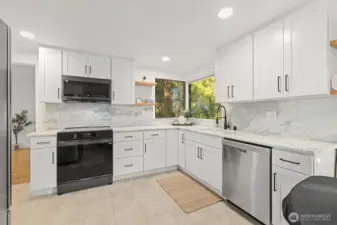 Updated kitchen with all brand new appliances, quartzite countertops, laminate flooring and custom cabinetry.