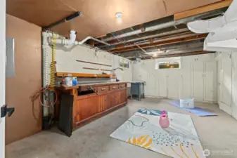 Utility room, with air compressors and workshop area.