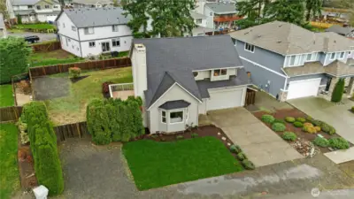 Overhead view of the home and lot showcasing ample parking and low-maintenance landscaping