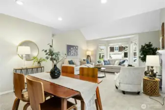Looking from the dining area into the living room—recessed lighting keeps the whole space feeling bright and welcoming