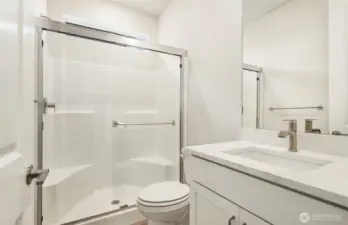 Bathroom to your right, just as you enter