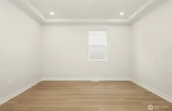 The spacious den with large barn doors to entry