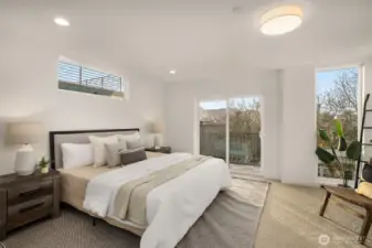 Airy primary bedroom with massive floor to ceiling windows creating an open light hearted energy. With a sliding glass door to give you a breath of fresh air turning this bedroom into a true retreat