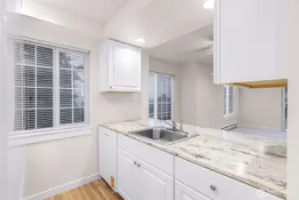 Unit #1 Kitchen, windows, appliances, cabinets/cupboards - a strong value-add component already executed for the next owner.