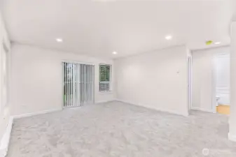 Unit #1 - Living room & deck (left) & bathroom (right)