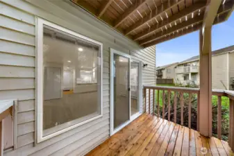 Unit #1 - Back deck.  Showing all new windows and slider.