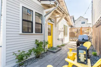 Daytime view of West facing outdoor patio and living area.