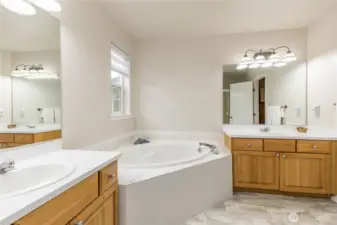 Private ensuite with soaking tub and dual vanities