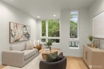 Open-concept floor plan with floor-to-ceiling light and modern urban views.