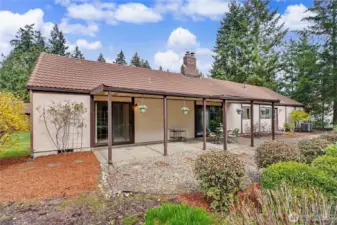 Spacious covered back patio. Mature landscapting.