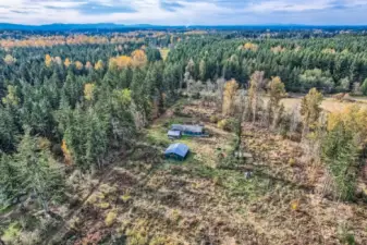 Property drivveway runs the Southern boundary line appoximately.  View is from East to West.  Property shaped as a rectangle.