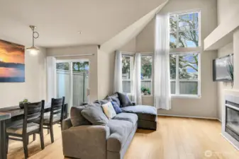 Great natural light in the living/dining room area with wall of windows. Gas fireplace.