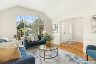 Another angle looking towards the entry. Note the vaulted ceiling and fine chair rail finish work.