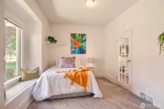 Main-floor primary bedroom offers ease and comfort