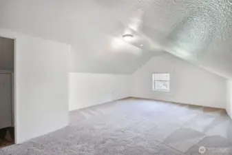 Generous upstairs bedroom with room to stretch out and wind down