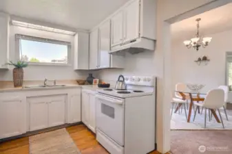 Bright kitchen with easy access to dining and laundry areas
