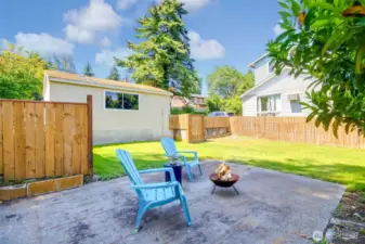 Room to relax and entertain by the fire pit area in the backyard