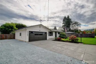 RV or extra parking on side of garage and access to backyard.
