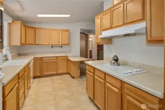 Kitchen not only has a breakfast nook but an eating bar.