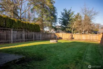 Another view of the Huge Level Backyard that is completely fenced.
