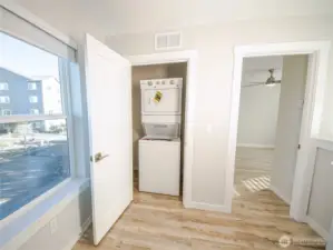 Upstairs utility closet.  Hard floors on second level is a new standard feature. *Previous build