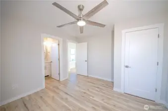 Guest room 1 with ceiling fan and attached bath. *Previous build