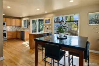Dining Room w/ its own slider leading out to the massive large covered year round entertaining/living deck area.