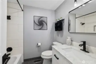 Guest full bathroom, ALL NEW completely updated tile floors, quartz vanity, new lighting, paint, Tile surround tub/shower and plumbing fixtures! BRAND NEW!
