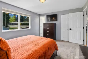 Primary Bedroom with two closets and a ensuite, new carpet, paint, doors and blinds.